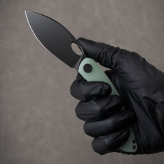 G064 in hand, open – Nature Green with black blade